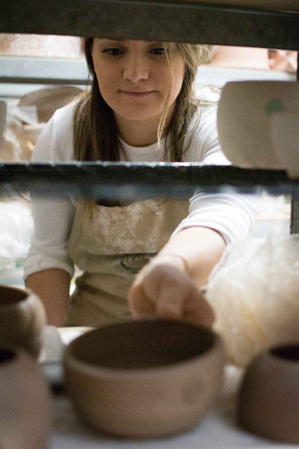 Handmade ceramic bowls in the Muds studio — custom birthday cake platters, Napa Valley